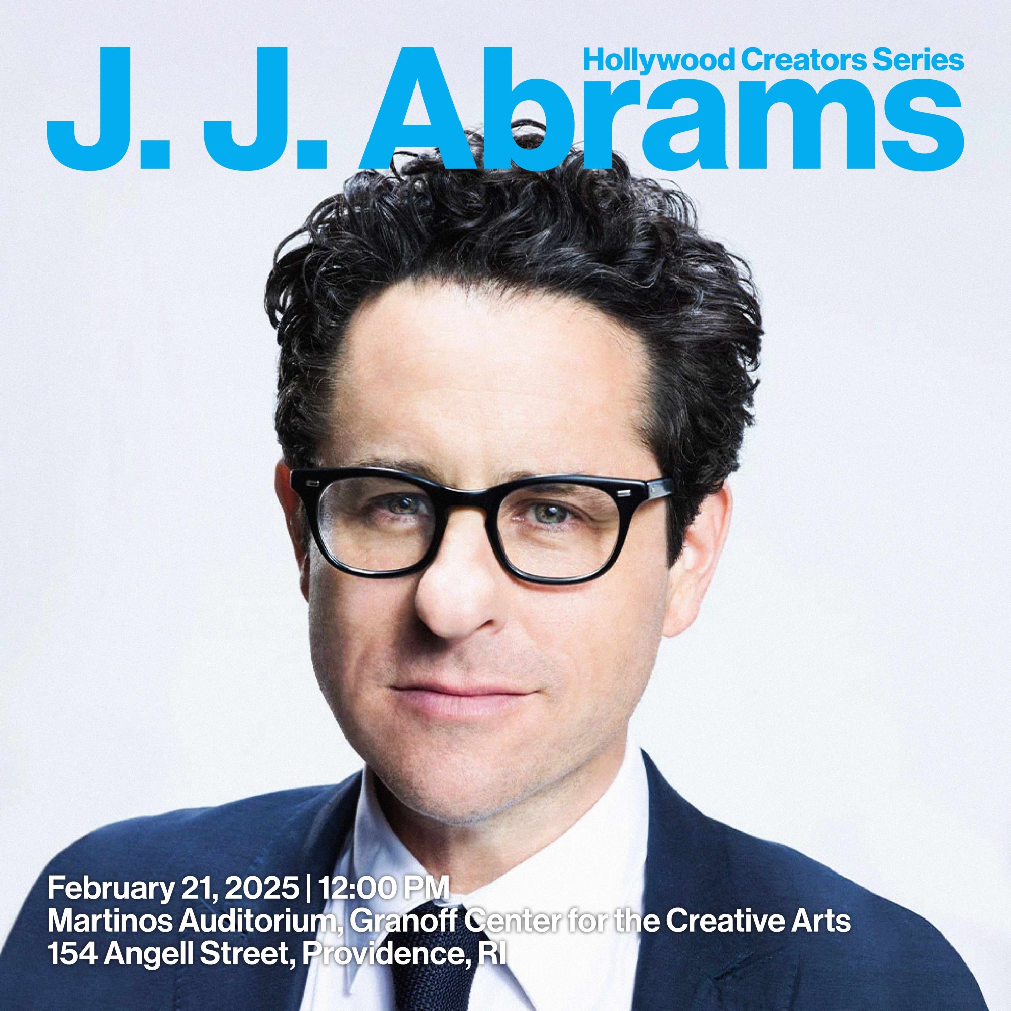 Headshot o JJ Abrams wearing black glasses against a blue background