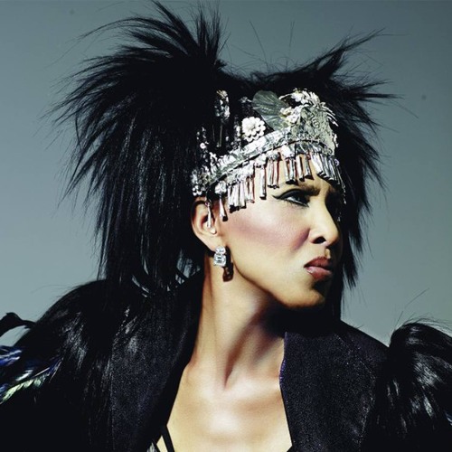 Nona Hendryx headshot. She is wearing a black feathered outfit and a silver headress.