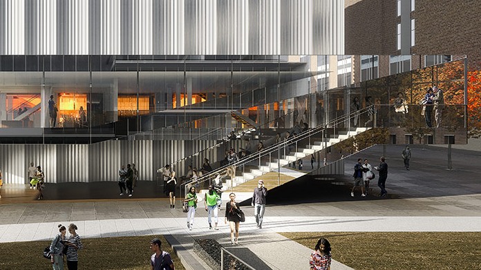 The main entrance of the Lindemann with people walking up the stairs into the lobby.