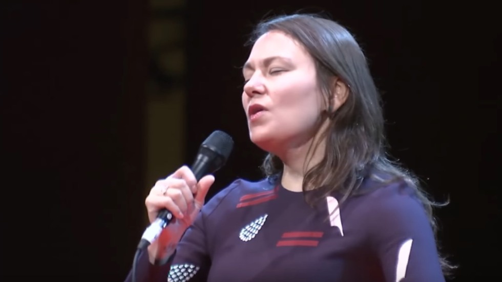 Tanya Tagaq performs into a micropohone