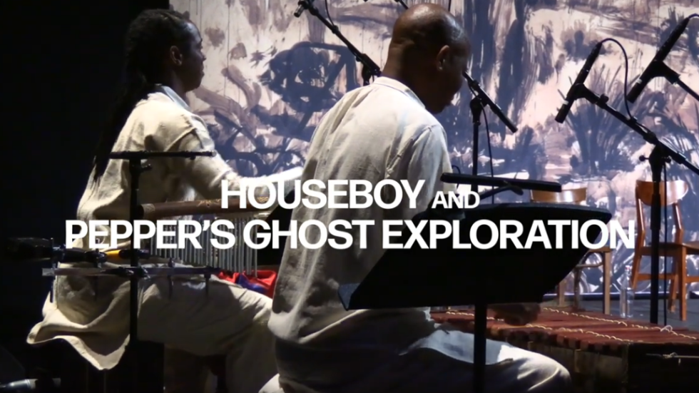 Two people playing drums with a colorful background. Houseboy and Pepper's Ghost Exploration in white text.