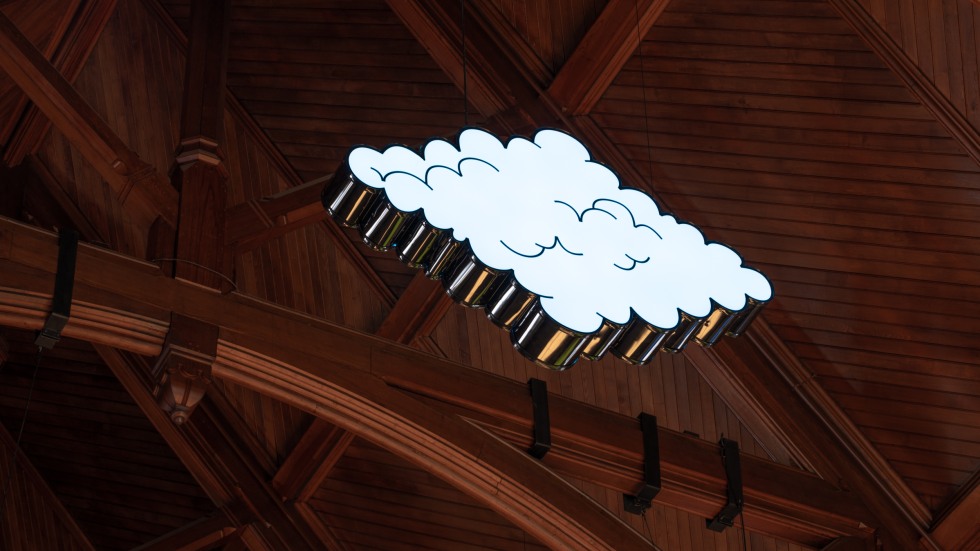 LED cloud sculpture hanging from the ceiling of Sayles Hall