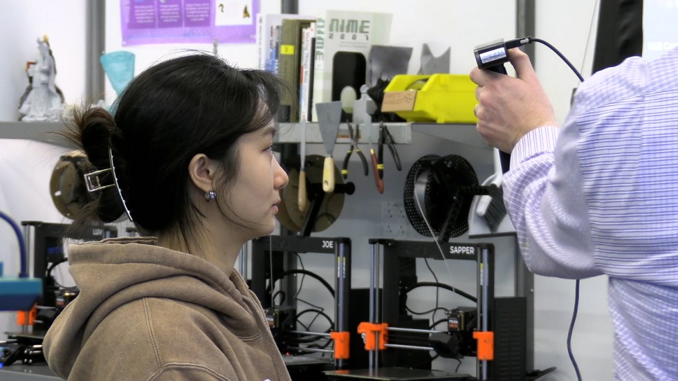A person getting their head 3-D imaged.